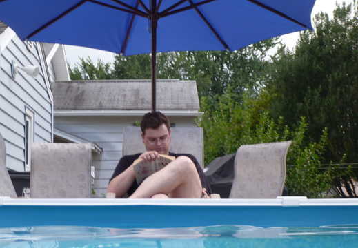 Brian reading poolside